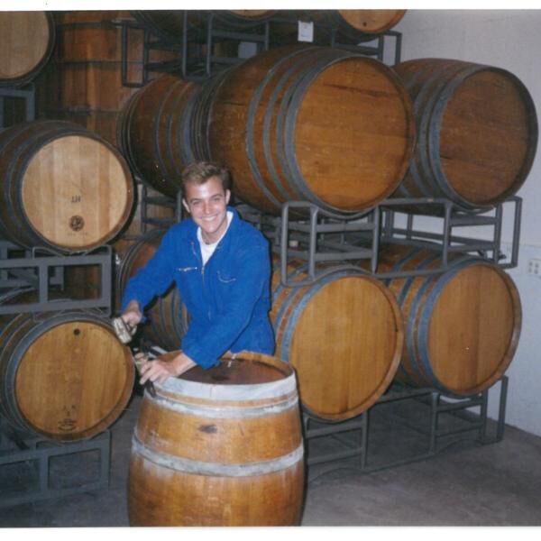 Greg Brewer working with some wine barrels